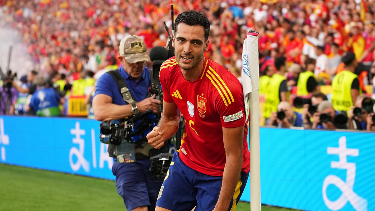 Mikel Merino celebrates after scoring an extra-time winner against Germany at Euro 2024.