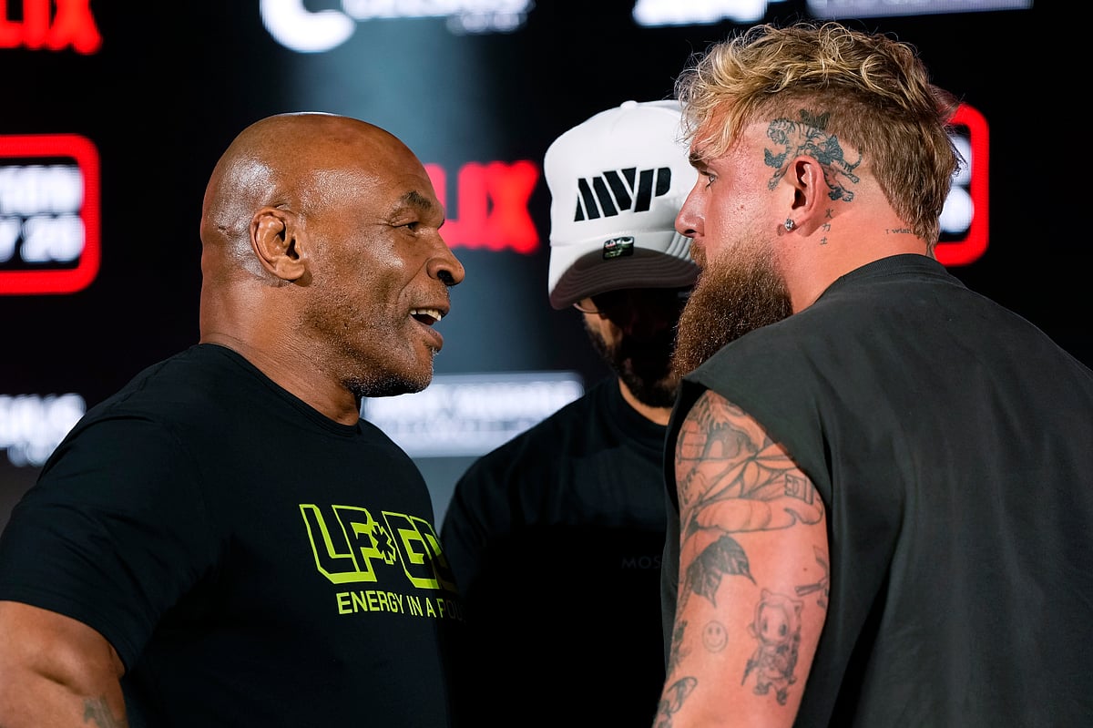 (AP Photo/Sam Hodde, File) : Mike Tyson, left, and Jake Paul, right, face off during a news conference promoting their upcoming boxing bout, May 16, 2024, in Arlington, Texas. 