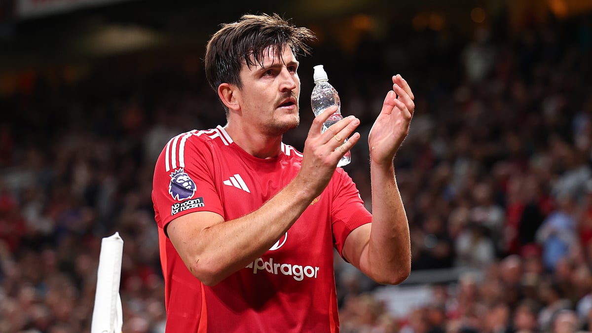 Harry Maguire applauds Manchester United's fans after Friday's win over Fulham.