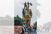 The BNP Seeks A Return To Democracy In Bangladesh Photo: Getty Images : Bring it Down: Protestors climbing a statue of Sheikh Mujibur Rahman in Dhaka