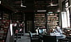 From Shelves To Screens: Libraries' Role In Today’s Digital World Getty Images : Lost in the sea of books - A man surfs through the books in National Library Bandra
