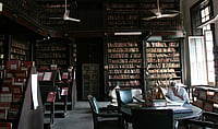 From Shelves To Screens: Libraries' Role In Today’s Digital World Getty Images : Lost in the sea of books - A man surfs through the books in National Library Bandra
