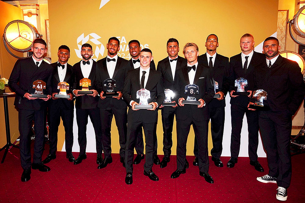 2024 Britain PFA Player Awards_Premier League team of the year pose with their trophies