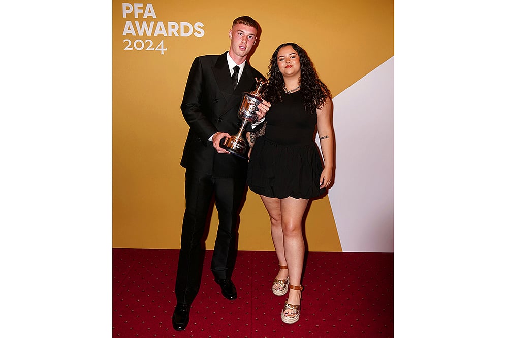 2024 Britain PFA Player Awards_Cole Palmer and sister Hallie with Young Player of the Year award
