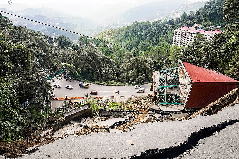 Damaged road after massive landslide at Baluganj in Shimla