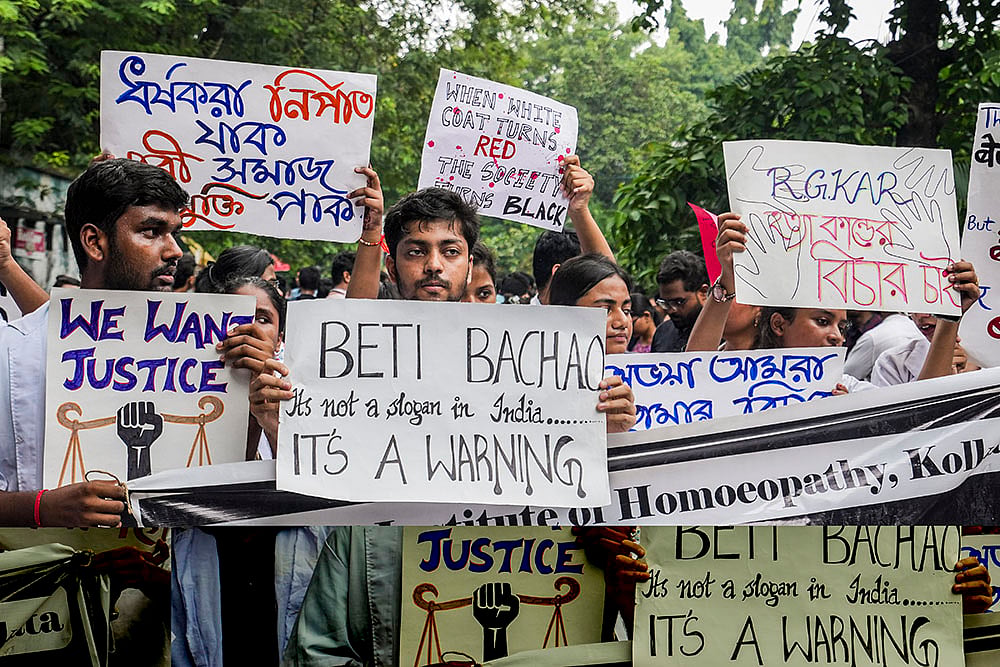 Doctors stage a protest over the alleged sexual assault and murder of a postgraduate trainee doctor