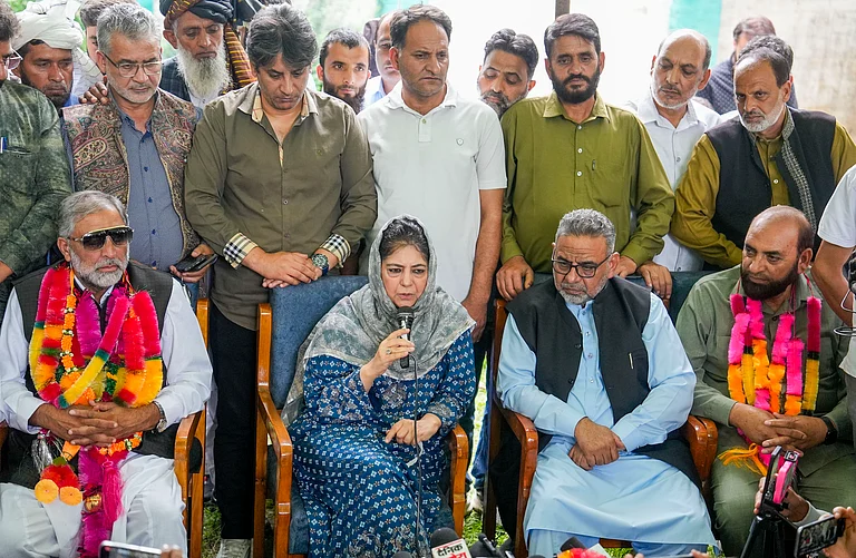Peoples Democratic Party (PDP) President Mehbooba Mufti welcomes Gujjar leader Qamar Ali, left, and his supporters from Rajouri - PTI Photo