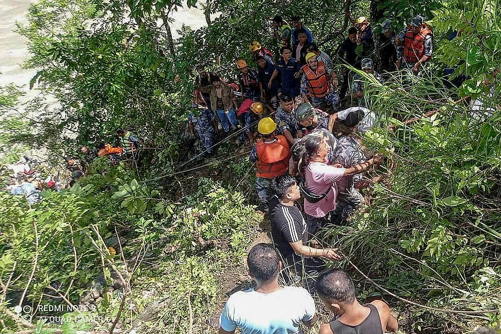 Indian bus falls into river in Nepal