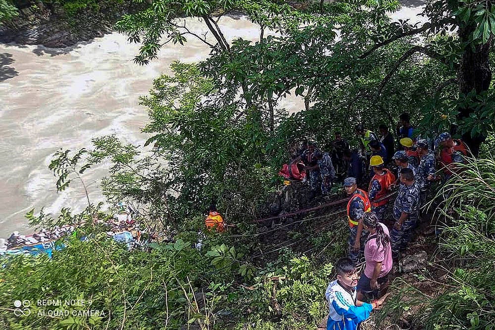 Indian bus falls into river in Nepal