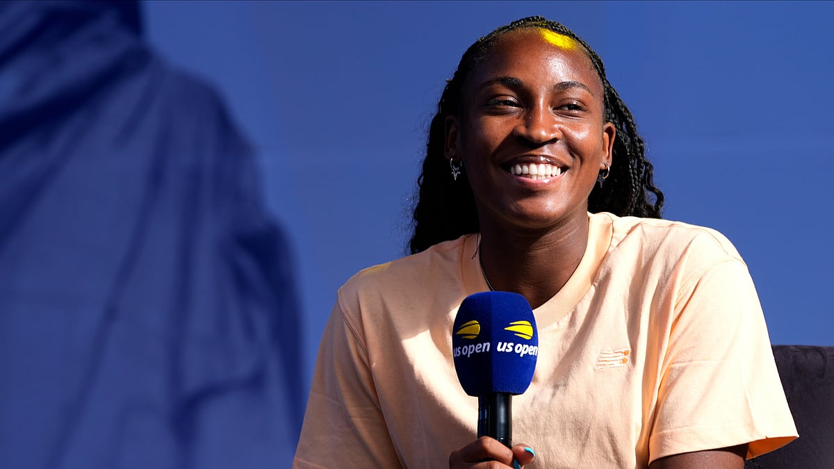 Coco Gauff smiles while speaking to the crowd at the US Open Fan Week at the USTA Billie Jean King National Tennis Center in New York. - AP Photo/Pamela Smith