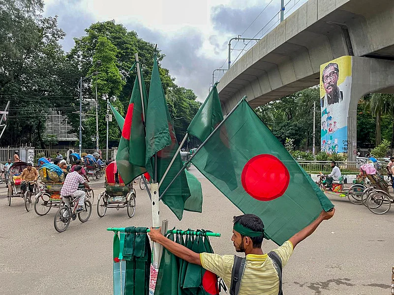 Dhaka: A flag-seller stands on the periphery of a memorial site