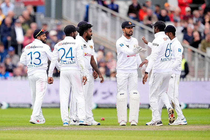 England vs Sri Lanka 1st Test, 2nd Day_ Dinesh Chandimal celebrates Englands Joe Root wicket