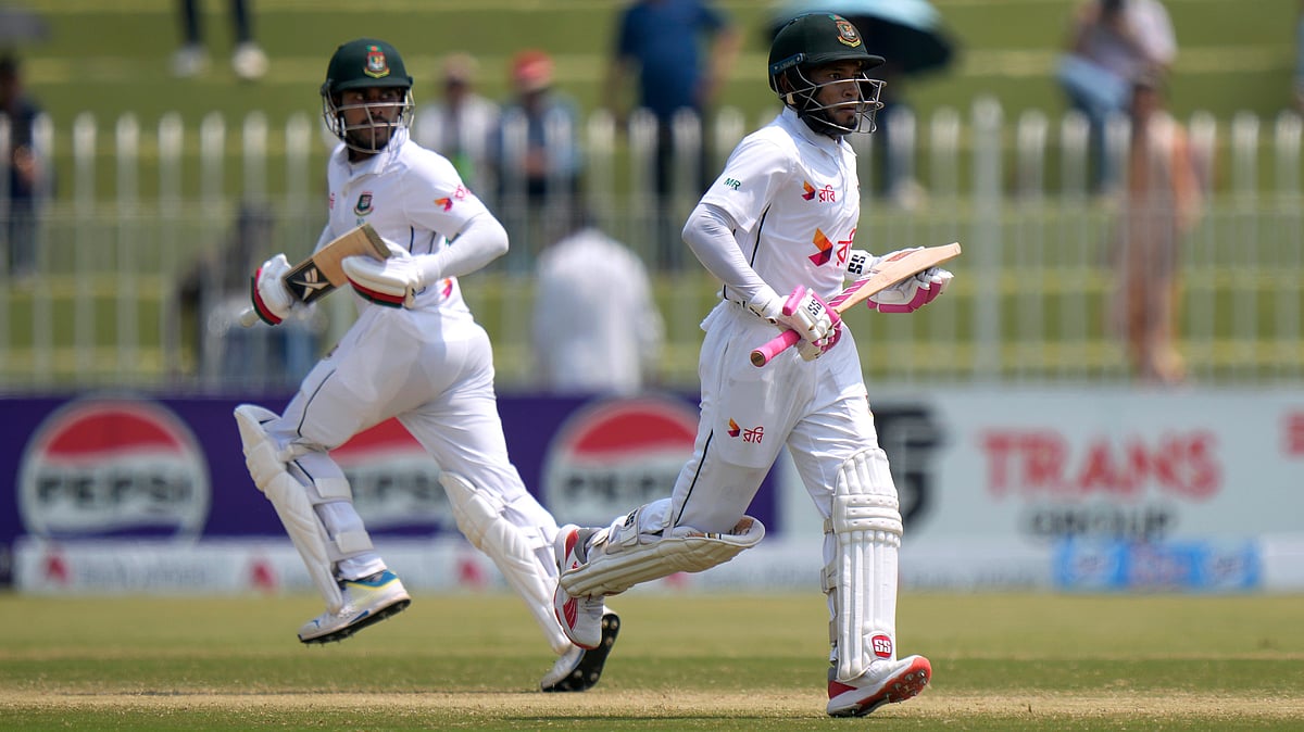 AP : Mushfiqur Rahim, right, and Mehidy Hasan Mirza run between the wickets during the fourth day of first Test match between Pakistan and Bangladesh, in Rawalpindi.