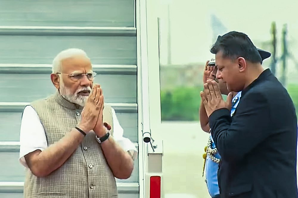 PM Narendra Modi greets as he arrives in New Delhi after his Poland and Ukraine visit