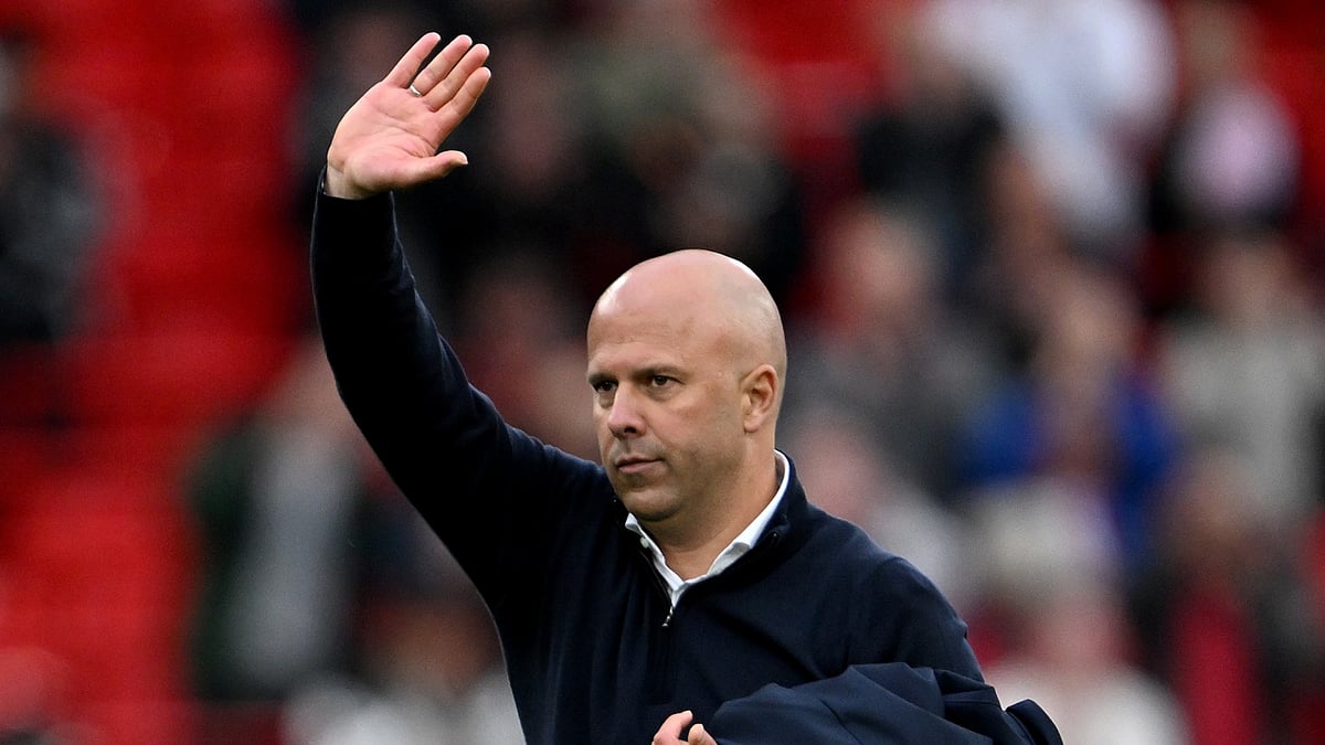 Arne Slot acknowledges the Liverpool fans after their win over Brentford - null