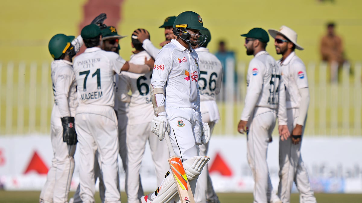 Shakib Al Hasan, front, walks off after his dismissal on the third day of first Test between Pakistan and Bangladesh in Rawalpindi. - AP
