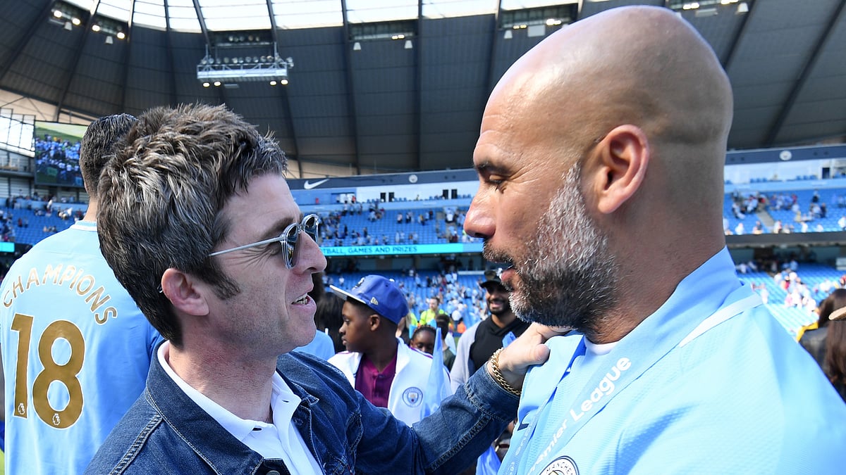 One half of Oasis, Noel Gallagher (left), with Manchester City manager Pep Guardiola - null