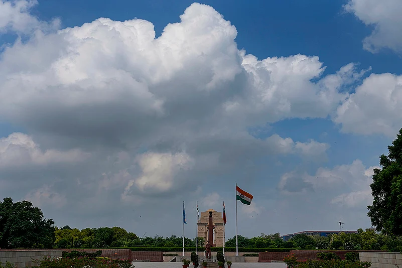 Clouds hover in the sky over the India Gate, in New Delhi