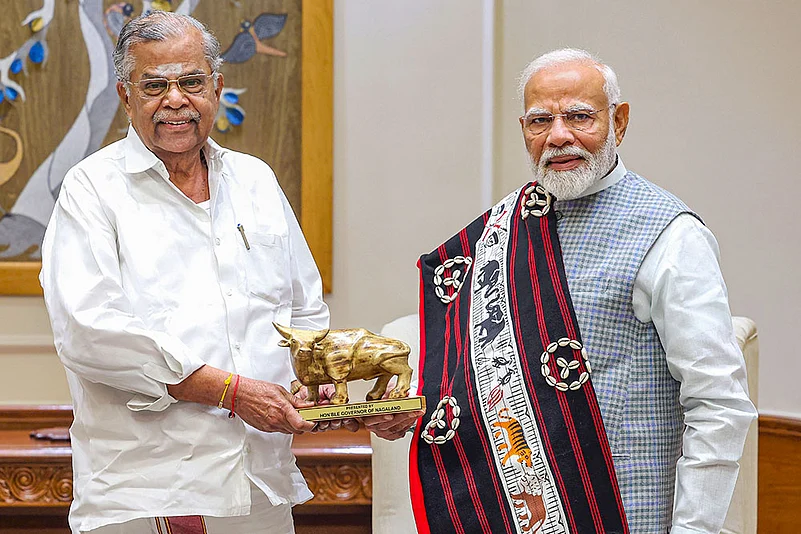 Prime Minister Narendra Modi being greeted by Nagaland Governor La Ganesan