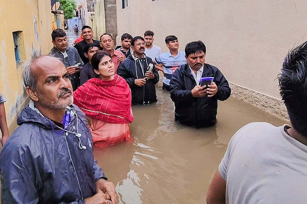 Gujarat Monsoon Rain and Floods_ BJP leader Rivaba Jadeja inspects a flood affected area in Jamnagar