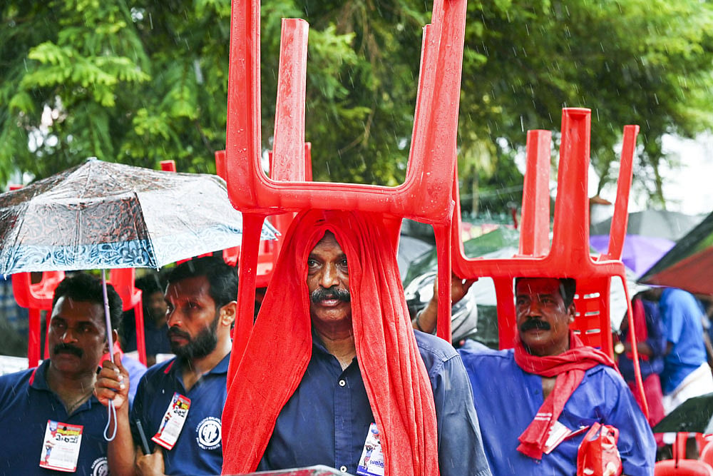 Porters protest demanding a hike in their wages in Thiruvananthapuram