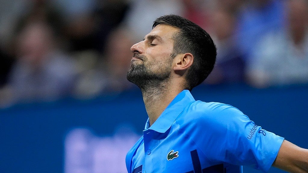 AP/Julia Nikhinson : Novak Djokovic reacts during his third-round loss to Alexei Popyrin at US Open 2024.