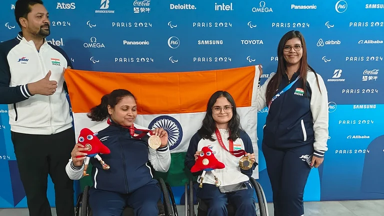 India's para shooters Avani Lekhara (second from right) and Mona Agarwal (third from right) celebrate with their medals at the Paris Paralympics. - PCI