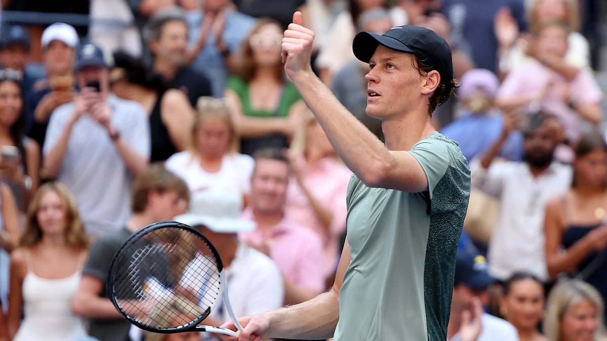 Jannik Sinner celebrates after converting match point against Christopher O'Connell.