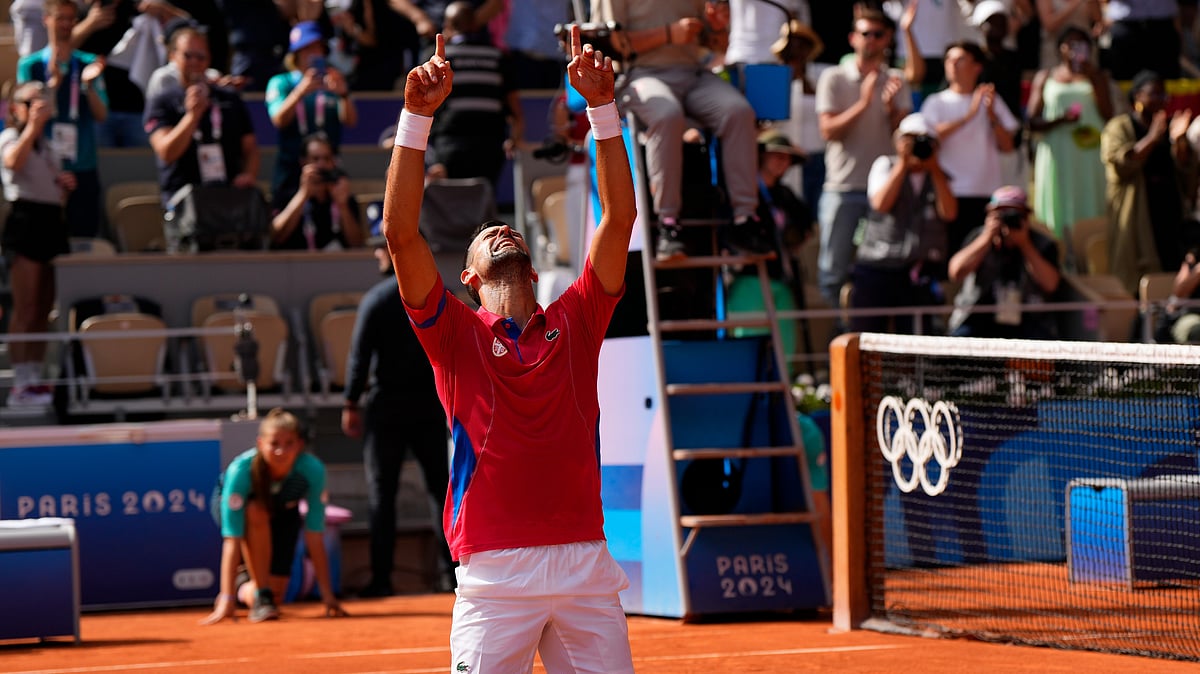 Novak Djokovic celebrates his first Olympic gold after beating Carlos Alcaraz