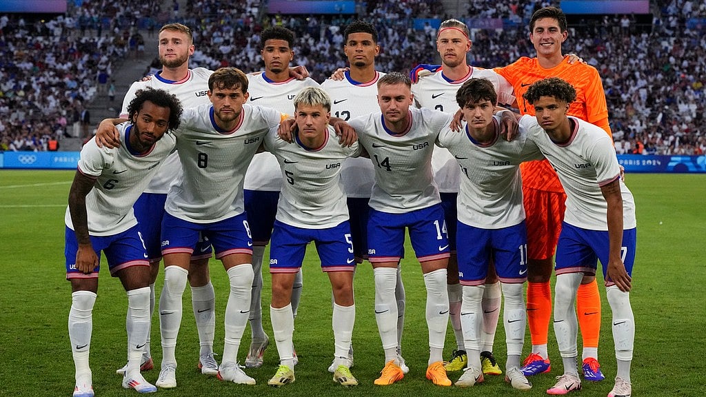 AP/Daniel Cole : The United States team pose for a team photo.