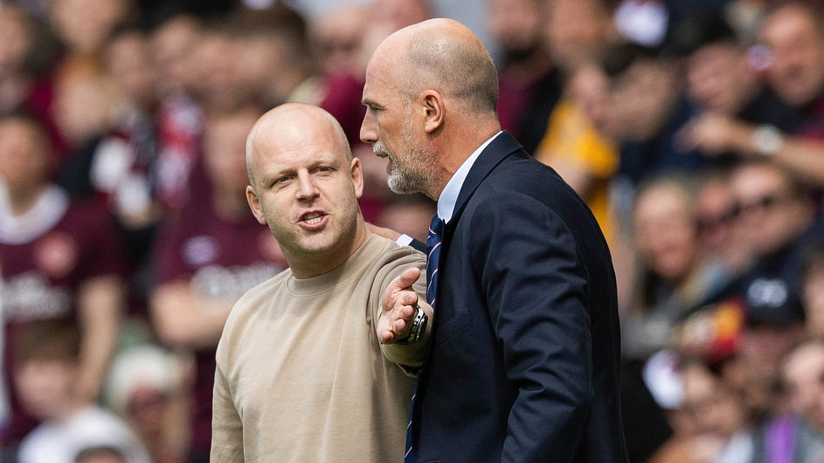 Steven Naismith and Philippe Clement have a heated discussion during the game.