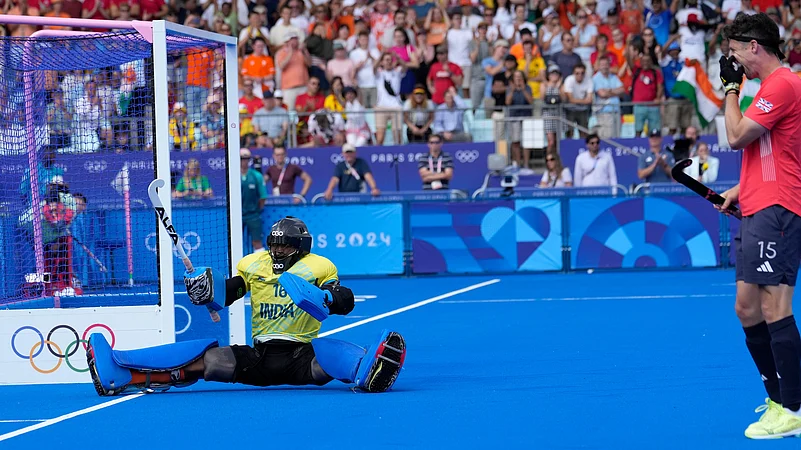 PR Sreejesh celebrates after a crucial save against Great Britain at Paris 2024