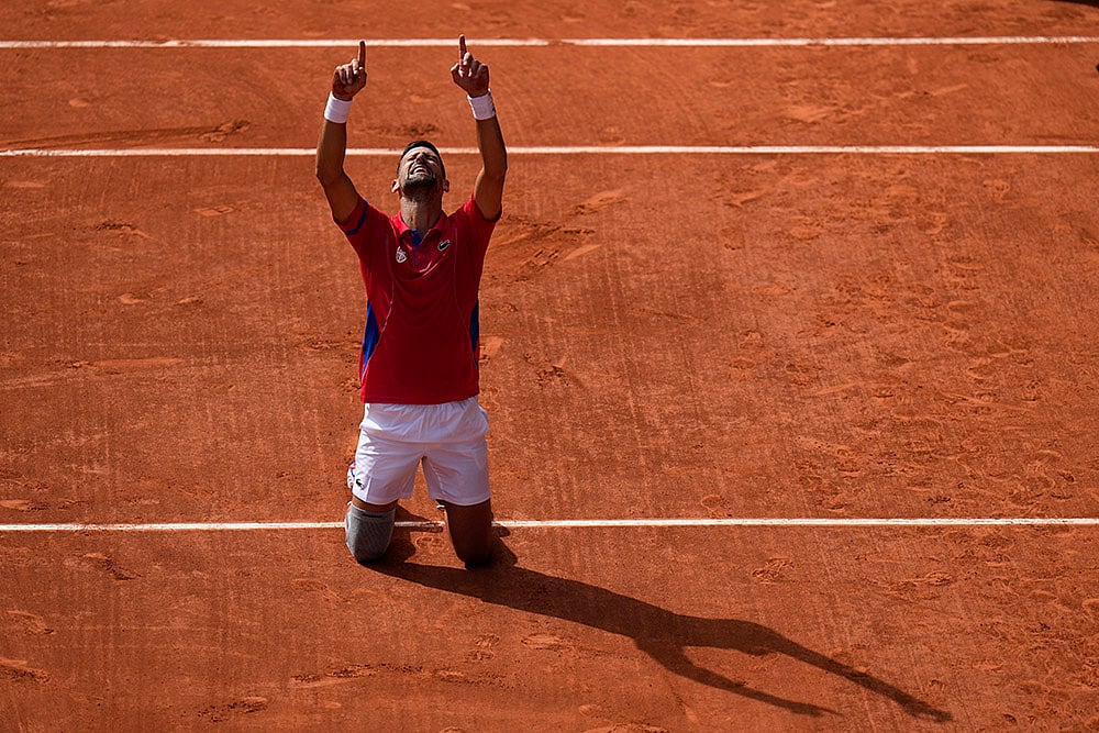 2024 Paris Summer Olympics Day 9 Photo Gallery_Serbias Novak Djokovic celebrates gold in Tennis