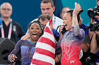 Suni Lee: American Star Gymnast Eyes Return To Her Third Olympics At 2028 LA Games (AP Photo/Natacha Pisarenko) : Simone Biles, left, celebrates with teammate Suni Lee, of the United States, after winning the gold and bronze medals respectively in the women's artistic gymnastics all-around finals in Bercy Arena at the 2024 Summer Olympics, Thursday, Aug. 1, 2024, in Paris, France.