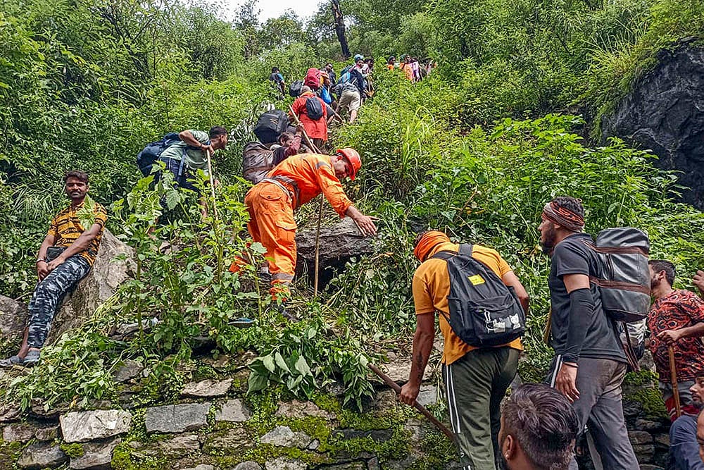 NDRF personnel evacuating stranded pilgrims after Cloudburst in Kedarnath