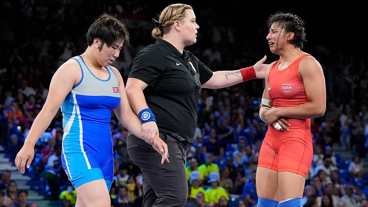 India's Nisha, right, reacts after the women's freestyle 68kg wrestling quarterfinal match against North Korea's Sol Gum Pak, left, at Champ-de-Mars Arena, during the 2024 Summer Olympics, Monday, Aug. 5, 2024, in Paris, France. -  AP Photo/Eugene Hoshiko