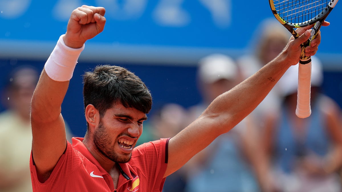 (AP Photo/Manu Fernandez) : Carlos Alcaraz of Spain celebrates his victory over Tommy Paul, of United States during their men's quarter-final match at the Roland Garros stadium, at the 2024 Summer Olympics, Thursday, Aug. 1, 2024, in Paris, France. 