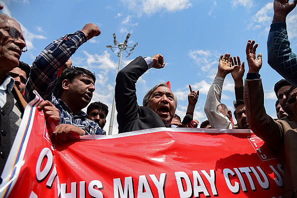 Getty Images : Leader of Communist party of India Mohd Yousuf Tarigami seen chanting slogans demanding job security and better pay