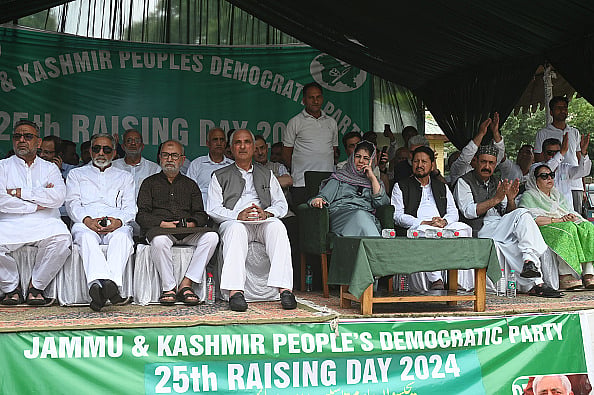 (Photo by Waseem Andrabi via Getty Images) :  Peoples Democratic Party (PDP) president Mehbooba Mufti and other party leaders during a public rally on the 25th Foundation Day of the party on July 27, 2024 in Srinagar, India. Peoples Democratic Party (PDP) president Mehbooba Mufti challenged Home Minister Amit Shah to form a committee with 20 representatives from each side of the Line of Control in Kashmir. This committee would meet biannually to discuss and address important regional issues. 