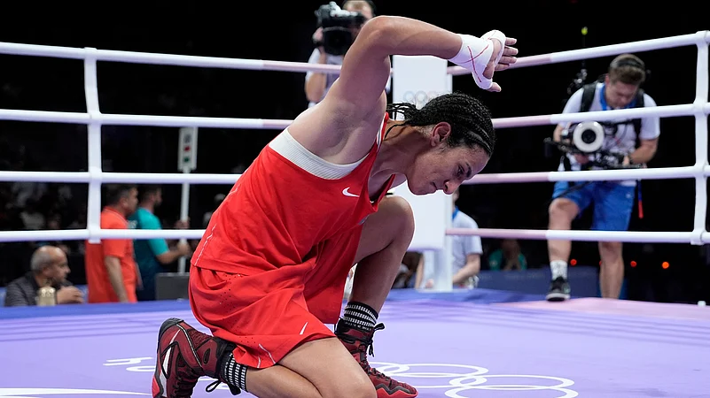 Imane Khelif, celebrates after defeating Hungarys Anna Hamori. AP Photo
