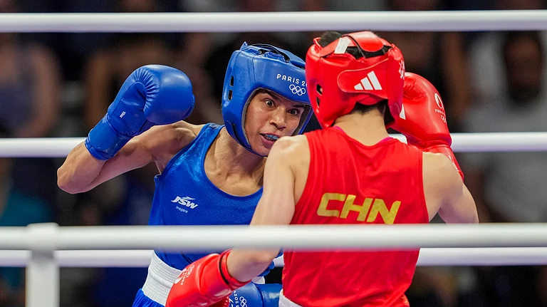 India's Nikhat Zareen (in blue) and China's Wu Yu during their women's 50kg Round of 16 boxing match at the 2024 Summer Olympics, in Paris. - PTI Photo/Ravi Choudhary