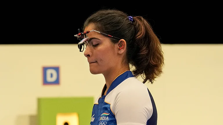 India's Manu Bhaker prepares to compete in the 25m pistol medal event at the 2024 Summer Olympics. - AP Photo/Manish Swarup