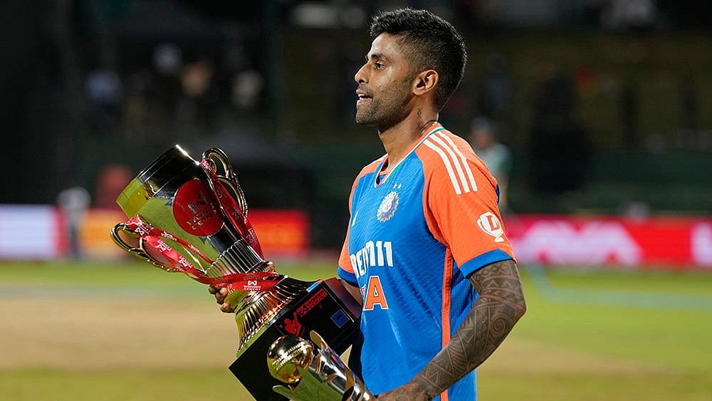 Suryakumar Yadav walks away with winners' trophy - | Photo: AP/Eranga Jayawardena