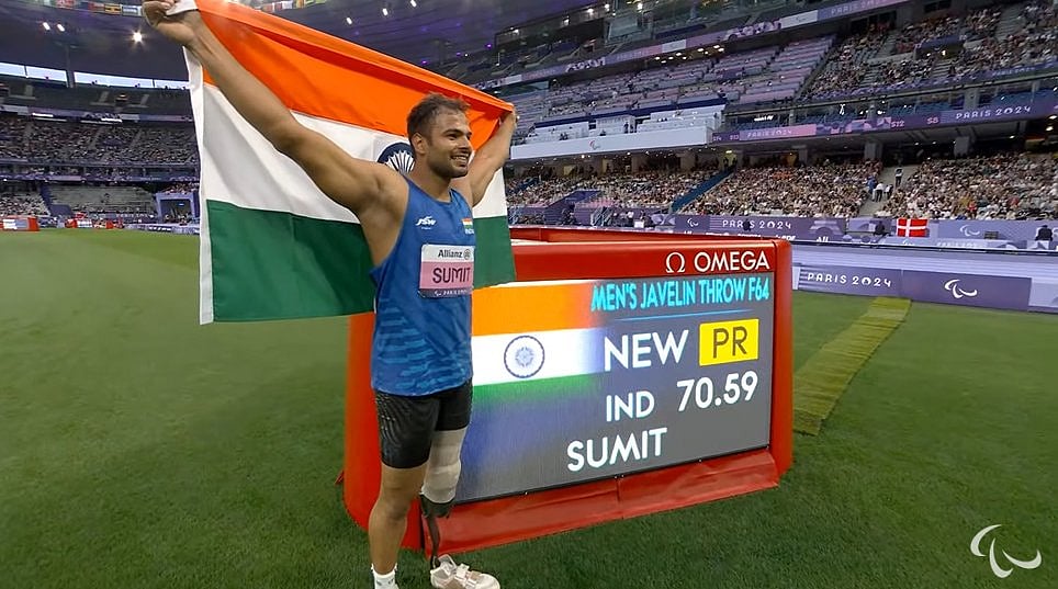 Olympics : India's Sumit Antil posing for the cameras after winning gold in the men's javelin F64 category.