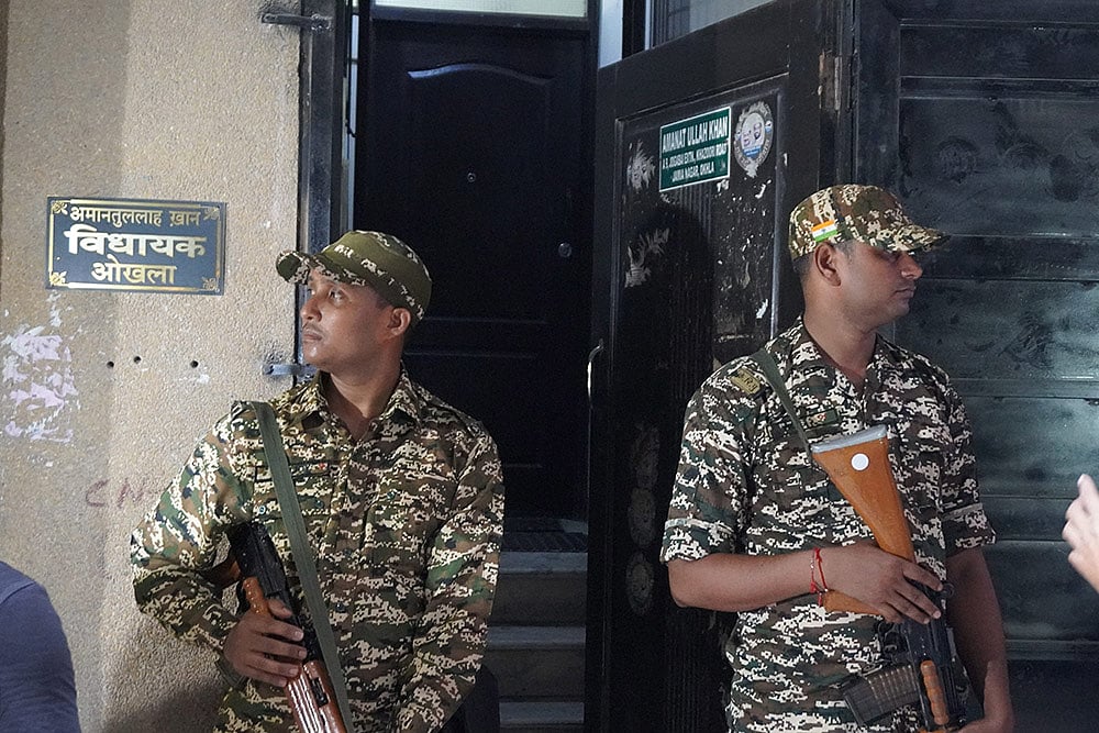 Security personnel stand guard  as ED raids Amanatullah Khans premises