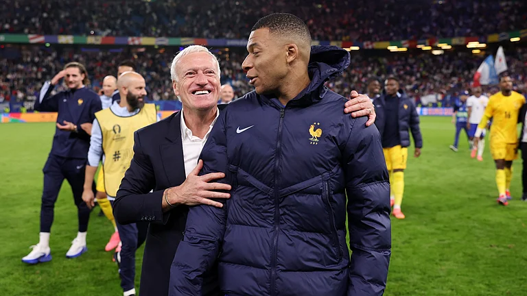 France head coach Didier Deschamps with captain Kylian Mbappe - null
