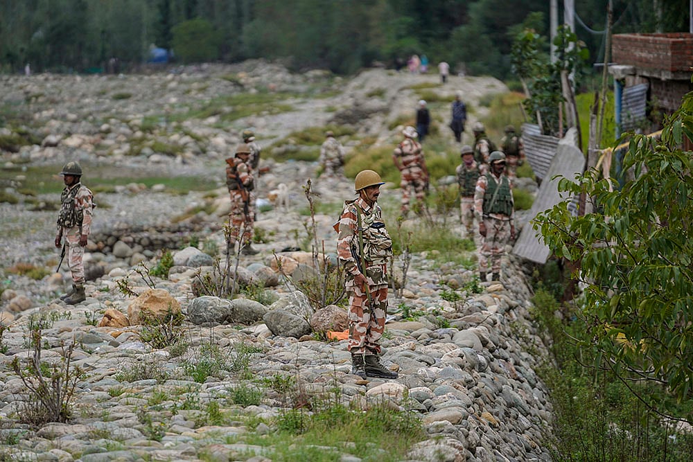 2024 J-K Assembly polls: Indian soldiers guard during an election rally at Dooru