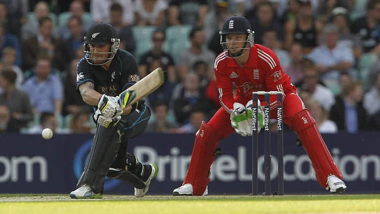 England coach Brendon McCullum and captain Jos Buttler as opposition players in 2013 - null