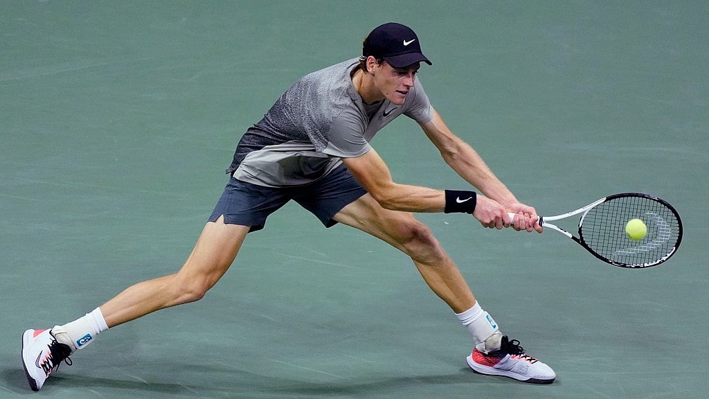 Jannik Sinner returns to Daniil Medvedev during their US Open 2024 men's singles quarter-finals match in New York. - AP/Eduardo Munoz Alvarez