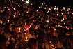 via Getty Images : People hold candles during a commemoration ceremony of the 1994 genocide on April 07, 2019 at Amahoro Stadium in Kigali, Rwanda.